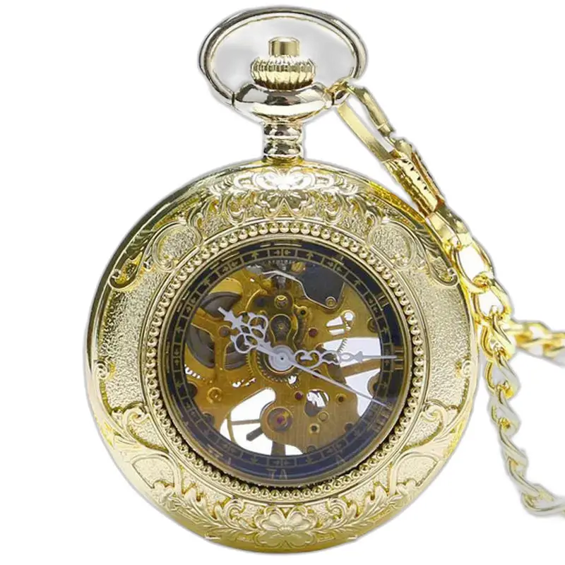 Golden Charm Luxe taskukello näkyvillä kultaisilla vaihteilla